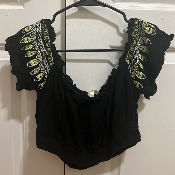 Black crop top with lime green and white tribal print. - Picture 2 of 2
